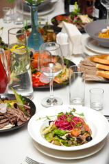 Banquet in the restaurant: salads, snacks and drinks