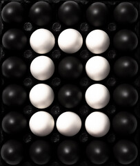 Black and White Eggs. Cultural Diversity Concept Image. Flat Lay Abstract Pattern