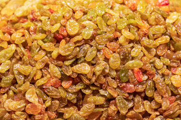 A heap of yellow raisins for background (Selective focus)