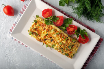 Fresh French omelet with fresh vegetables. Vegetarian food