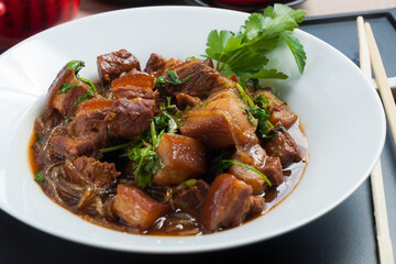Asian cuisine: pork with glass noodles and soy sauce