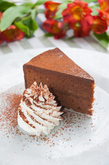 Sacher cake with whipped cream. Vertical frame