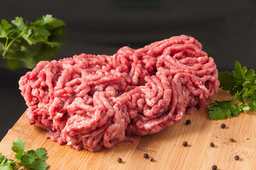 fresh raw minced pork on a wooden Board