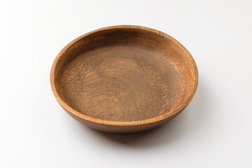 Wooden bowl on white background