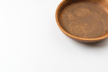 Wooden bowl on white background