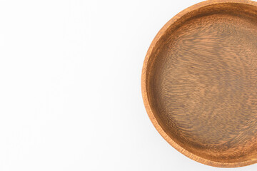 Wooden bowl on white background
