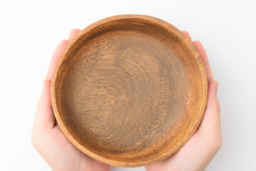 Wooden bowl on white background