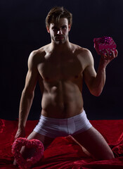 be my valentine. sexual health and libido. desire and erotic games. man hold gift box. sexy and...