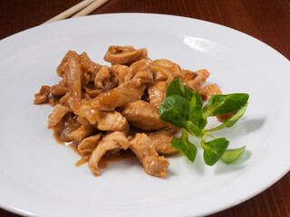 teriyaki chicken on a white plate. Asian cuisine