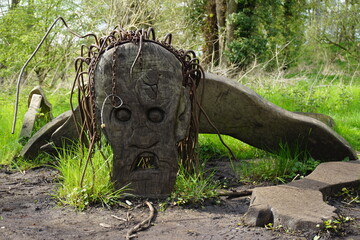 Demon, monster wooden sculpture in Beowulf and Grendel Trail, West Stow Country park Suffolk UK