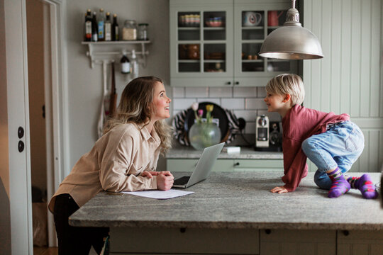 Mother and son in kitchen