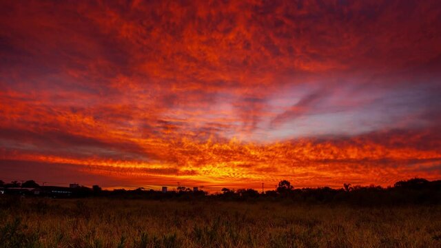 Sunset time lapse over the field at Campeche beach in Florianopolis, Santa Catarina - Brazil