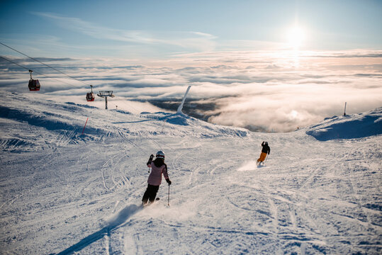 People skiing in ski resort in winter