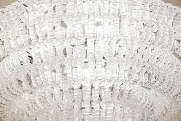 Beautiful white large crystal chandelier, close-up.