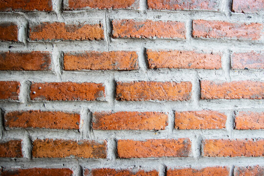 Red Rough Brick Wall Background And Texture.