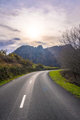Beautiful road at sunrise in the mountains of Aiako Harria or Peñas de Aya, Guipúzcoa. Basque Country