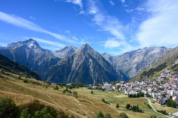 Fototapeta premium Landscape with view on ski station Les deux Alpes and Alpine mountains peaks in summer, Isere, France