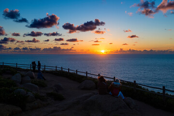 People watching the sunset at the Cabo da Roca (Roca Cape) in Sintra, Portugal.