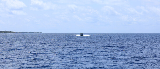 paradise idyllic seascape in the Indian Ocean, turquoise water and blue sky