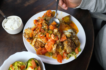 avocado baked stuffed with vegetables, plate of vegan food, post-holiday detox, diet, healthy vegetarian food concept
