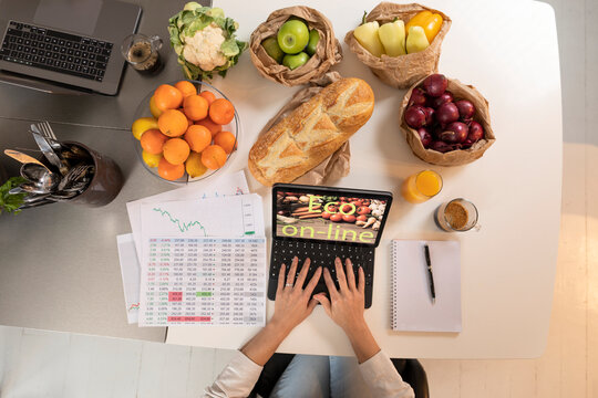High angle view of person using laptop in kitchen