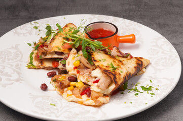 bright and juicy Mexican quesadilla with hot sauce