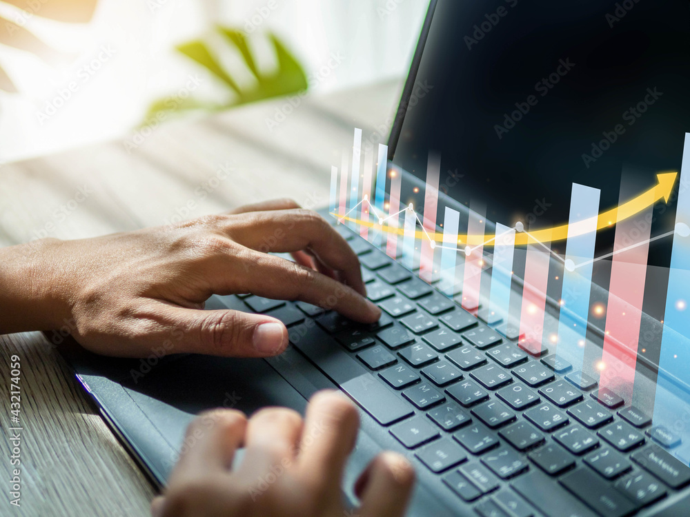 Poster working from home on laptop.financial of business with graph chart and diagram.man typing keyboard l