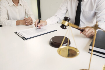 Lawyer discuss the contract and legal document agreement in office. Law and legal concept