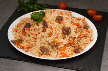 Uzbek pilaf with beef on a white plate