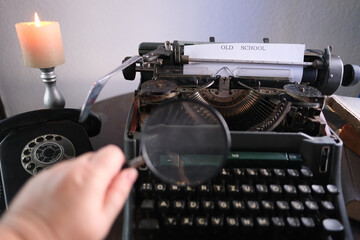 old typewriter on table, words true story are printed on paper in large size, retro style,...