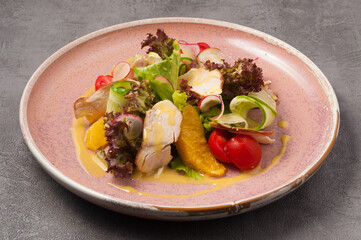 salad with duck, orange, vegetables and mango sauce