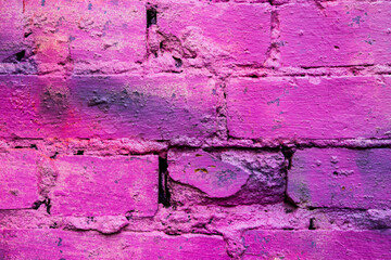 Purple and old brick wall. Close up view
