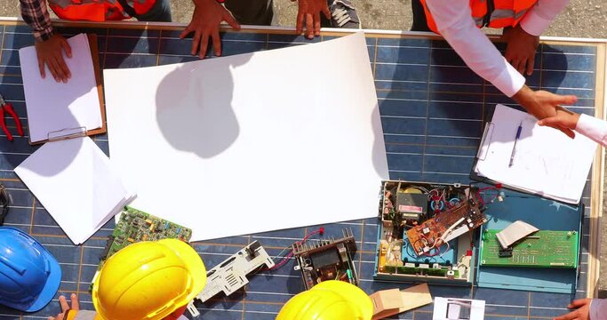 Ethnic diversity people, Business Success teamwork concept. Technical expert in solar photovoltaic panels and african american black people worker discussion with engineer woman in new project