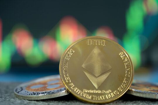 Focus select and blur Golden Ethereum ETH and bitcoin group cryptocurrency symbol and stock chart candlestick on tablets. Use technology cryptocurrency blockchain. with Capital Gain, Fundamental.