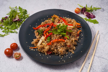 Chinese fried rice with vegetables garnished with green onions