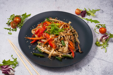 Udon wheat noodles with vegetables and sesame seeds