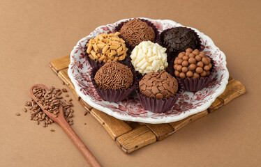 Typical brazilian brigadeiros on a plate with chocolate sprinkles