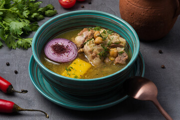 soup with lamb on the bone, vegetables and chickpeas
