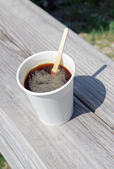 White plastic cup of coffee