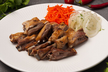 lamb skewers on the bone, with onions and carrots