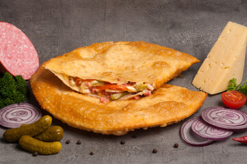 cheburek with alternative filling: cheese, vegetables and ham
