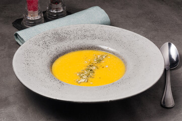 pumpkin cream soup decorated with pumpkin seeds. healthy diet