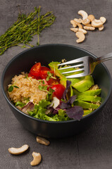 vegetarian poke with avocado, quinoa and tomatoes