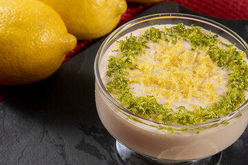 Lemon mousse in crystal bowl with lemon zest