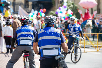 Police bicycle unit guard the public event.