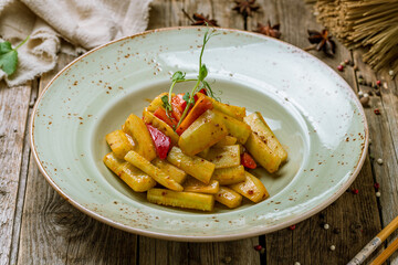 cucumbers sour and spicy chinese cuisine on old wooden table