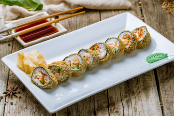 Hot roll with crab and eel on old wooden table