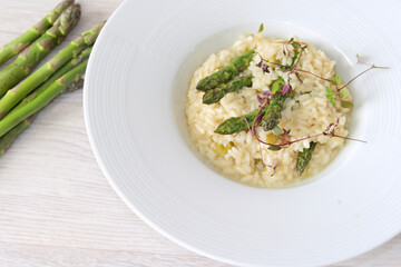 Asparagus risotto on a white plate