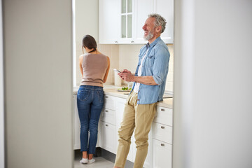 Handsome senior male laughing at funny joke
