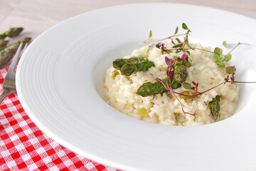 Asparagus risotto on a white plate